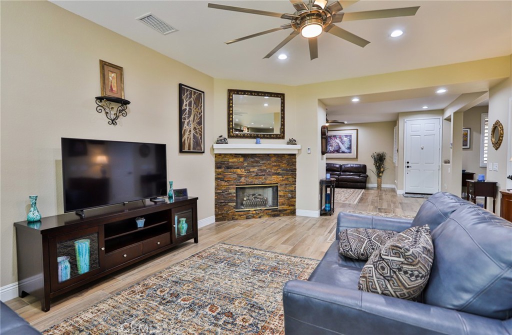 1789 Kapalua Bay Lane Corona, CA 92883 - Photo 17 of 63 a living room with furniture and a flat screen tv