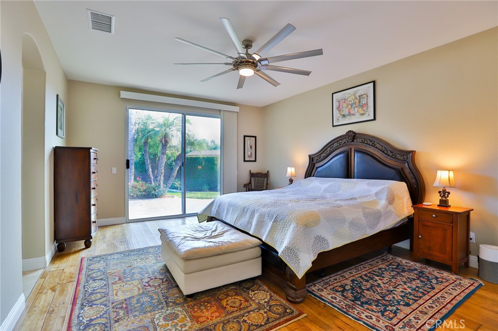 1789 Kapalua Bay Lane Corona, CA 92883 - Photo 29 of 63 a bedroom with a bed and a large window