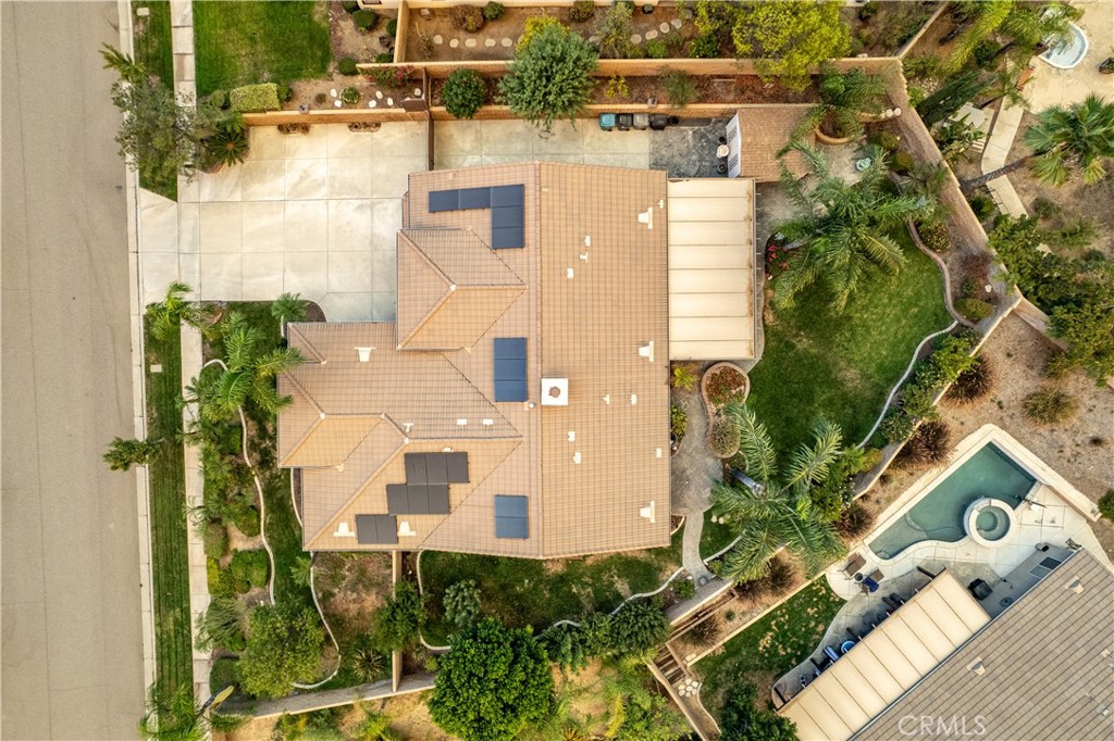 1789 Kapalua Bay Lane Corona, CA 92883 - Photo 3 of 63 an aerial view of a residential apartment building with a yard and potted plants