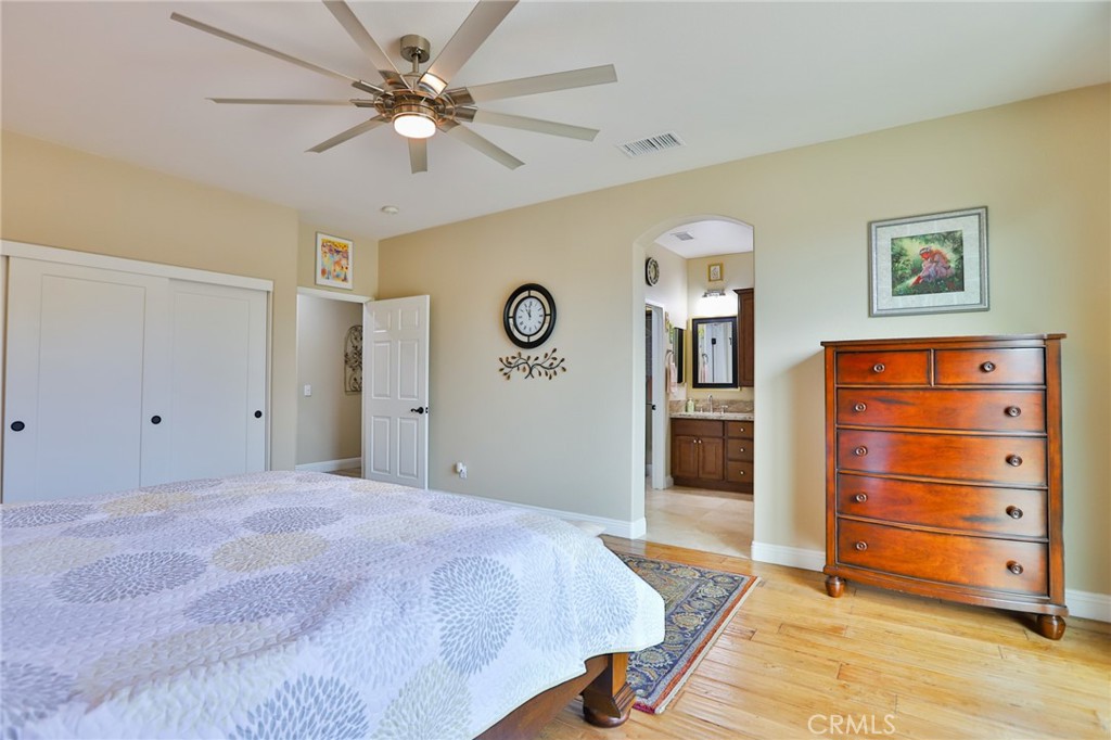 1789 Kapalua Bay Lane Corona, CA 92883 - Photo 31 of 63 a bedroom with a bed and a dresser