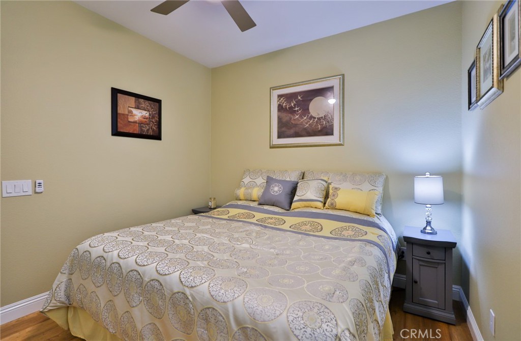 1789 Kapalua Bay Lane Corona, CA 92883 - Photo 39 of 63 a large bed sitting in a bedroom next to a lamp