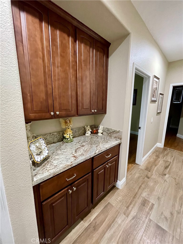 1789 Kapalua Bay Lane Corona, CA 92883 - Photo 40 of 63 a view of a kitchen with granite countertop cabinets