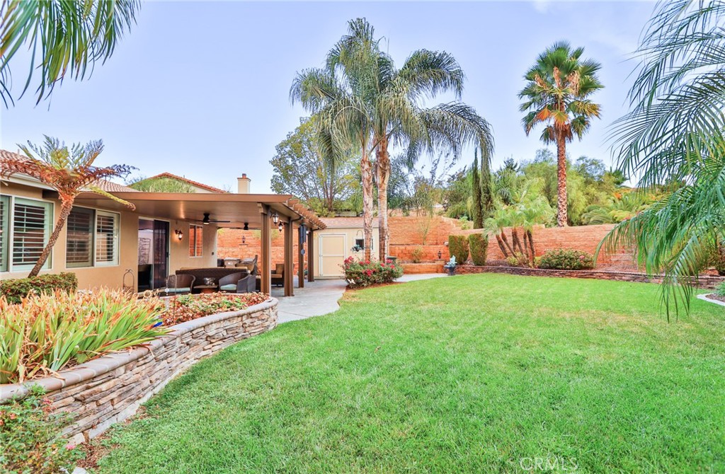 1789 Kapalua Bay Lane Corona, CA 92883 - Photo 51 of 63 a view of a chair and table in the garden