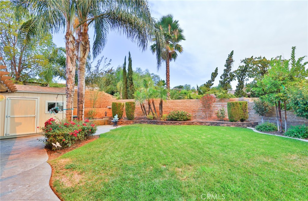 1789 Kapalua Bay Lane Corona, CA 92883 - Photo 52 of 63 a view of a backyard with a garden