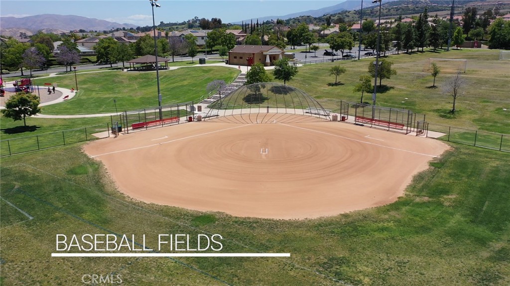 1789 Kapalua Bay Lane Corona, CA 92883 - Photo 59 of 63 a view of a golf course with a lake view