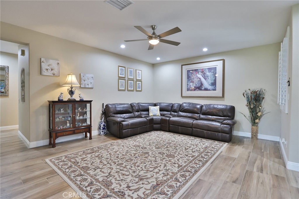 1789 Kapalua Bay Lane Corona, CA 92883 - Photo 7 of 63 a living room with furniture and wooden floor