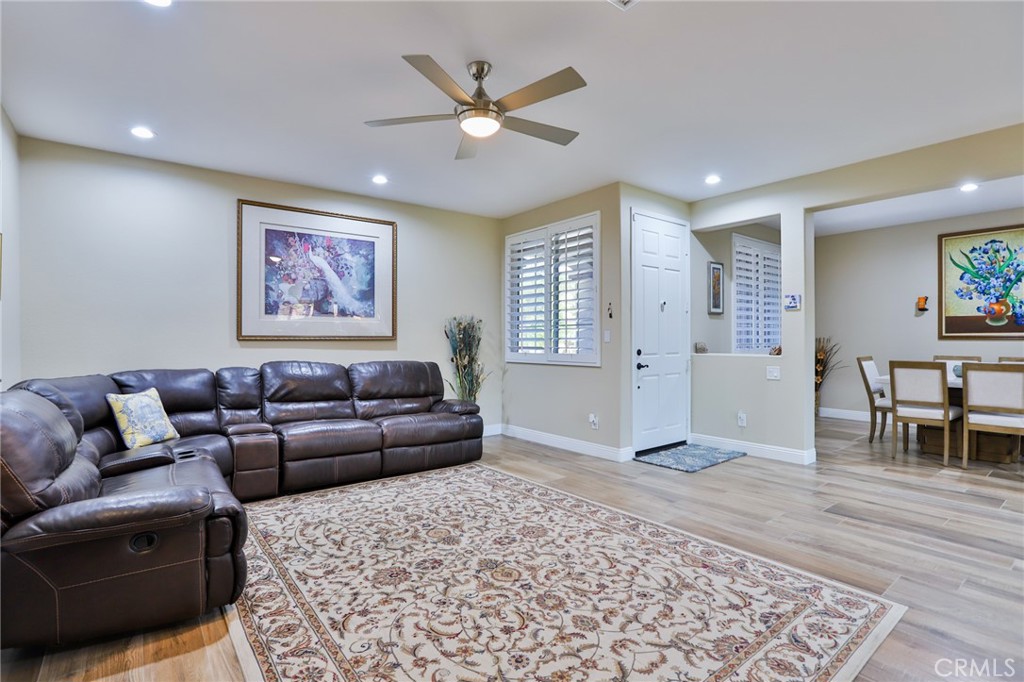 1789 Kapalua Bay Lane Corona, CA 92883 - Photo 9 of 63 a living room with furniture and a rug