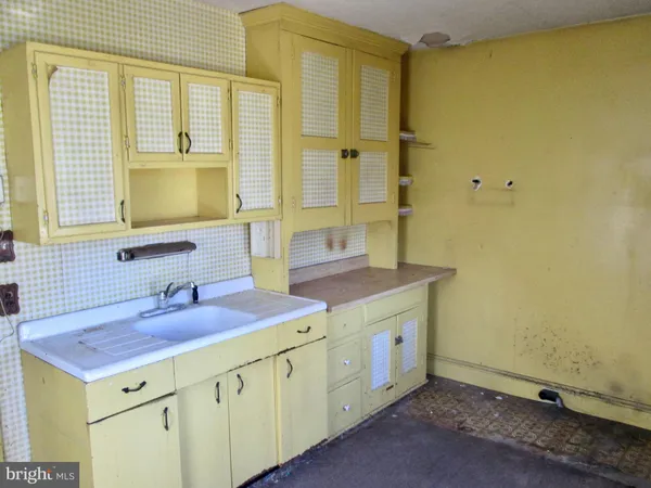 a bathroom with a sink a mirror and a shower