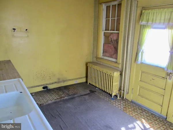 a view of front door with yard