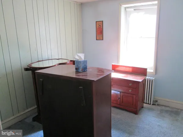 a view of a room with a table and a cabinet