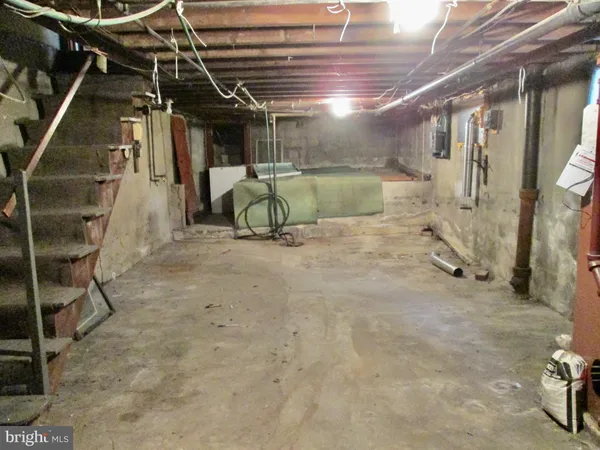 a room with water heater and a cabinet