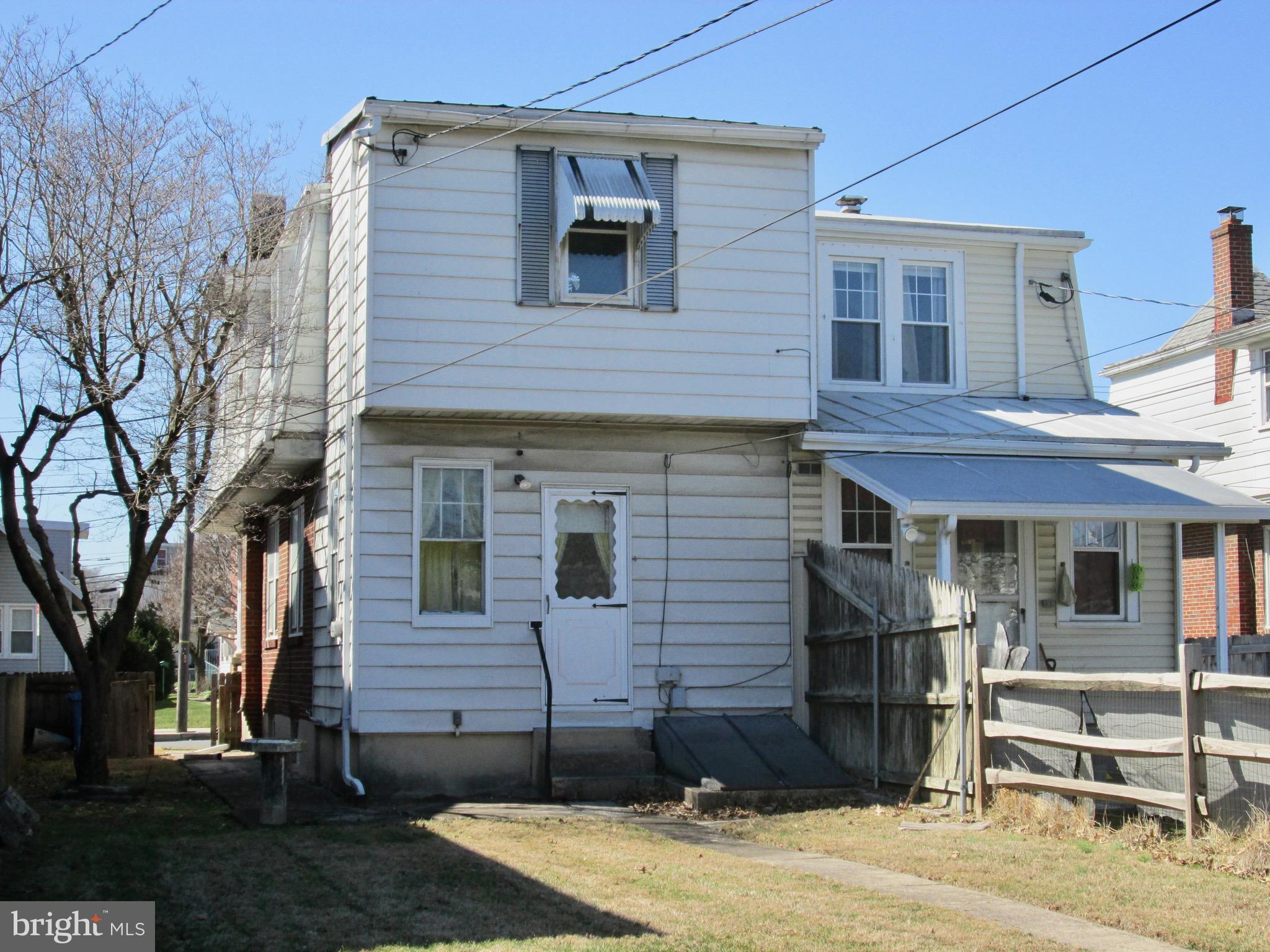 431 Raymond Street Reading, PA 19605 - Photo 42 of 50 a front view of a house with a yard
