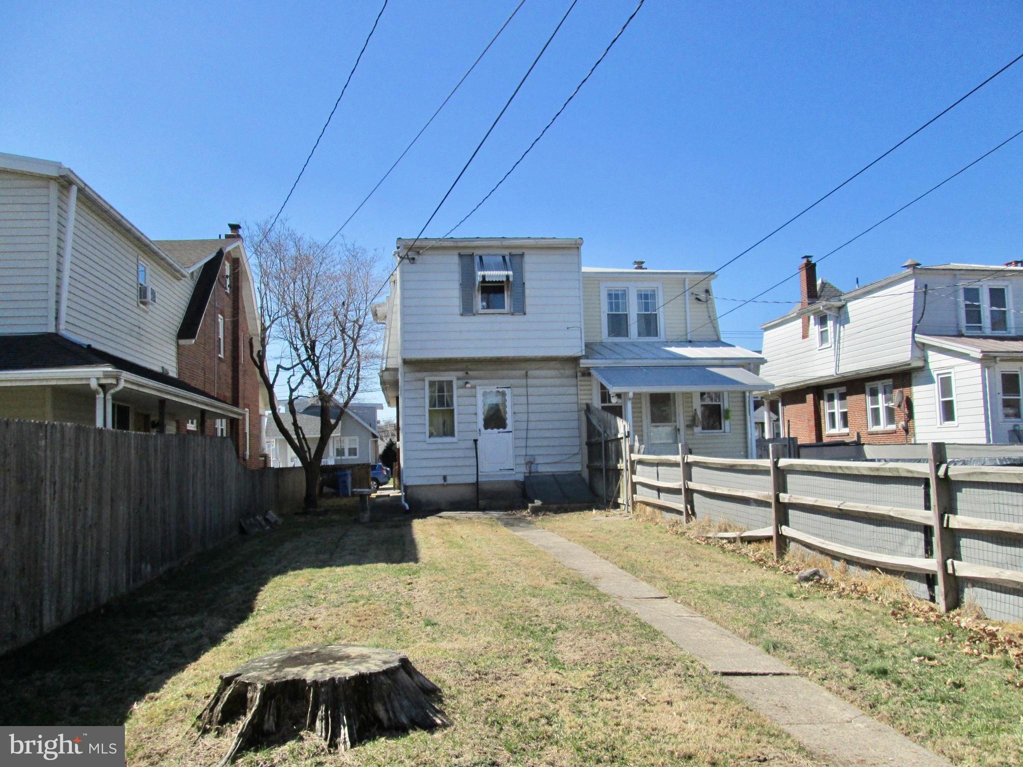 431 Raymond Street Reading, PA 19605 - Photo 43 of 50 a front view of a house with a yard