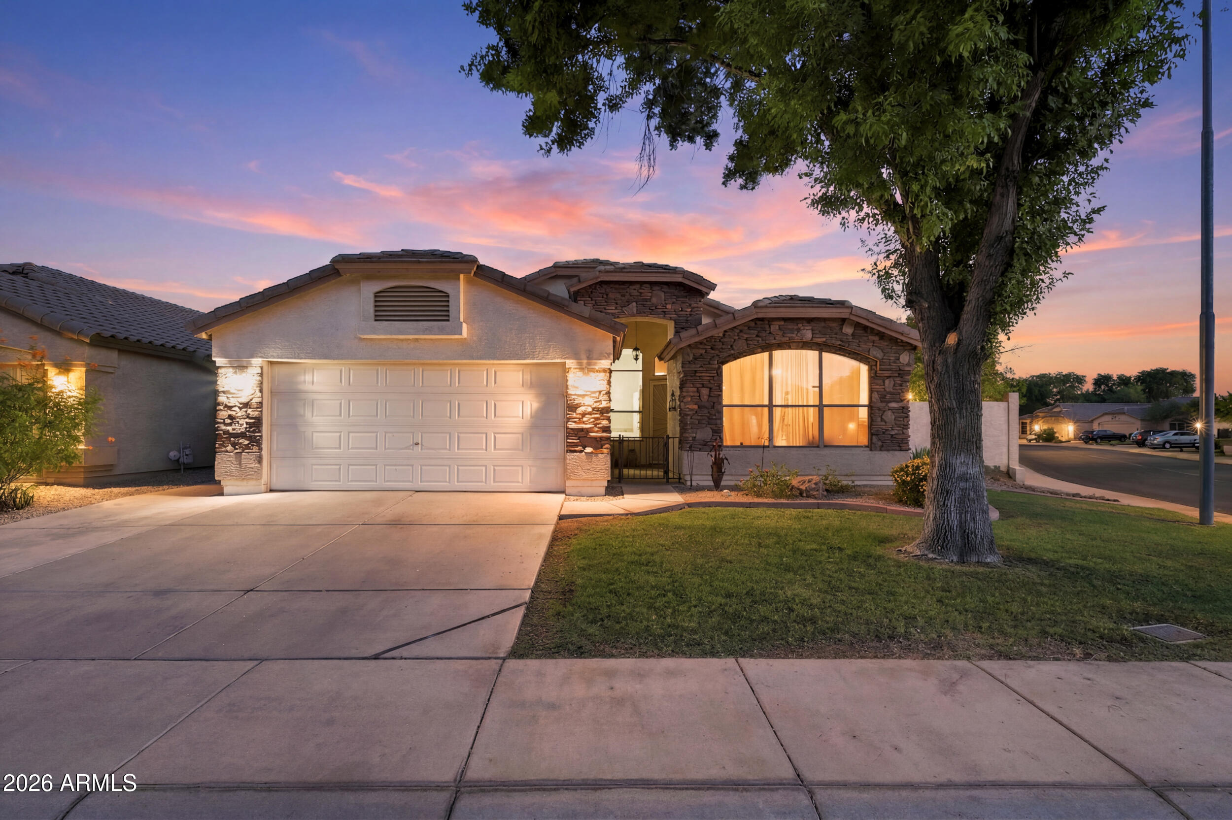 12813 West Monte Vista Road Avondale, AZ 85392 - Photo 1 of 53 1_dsc00672_twilight_6c42609d_68d16580