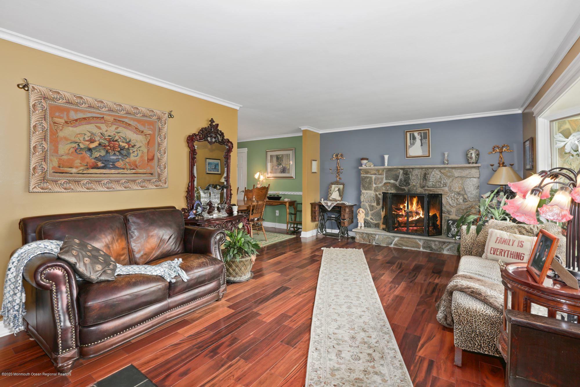 429 Crestview Terrace Brick, NJ 08723 - Photo 11 of 29 a living room with furniture fireplace and a window