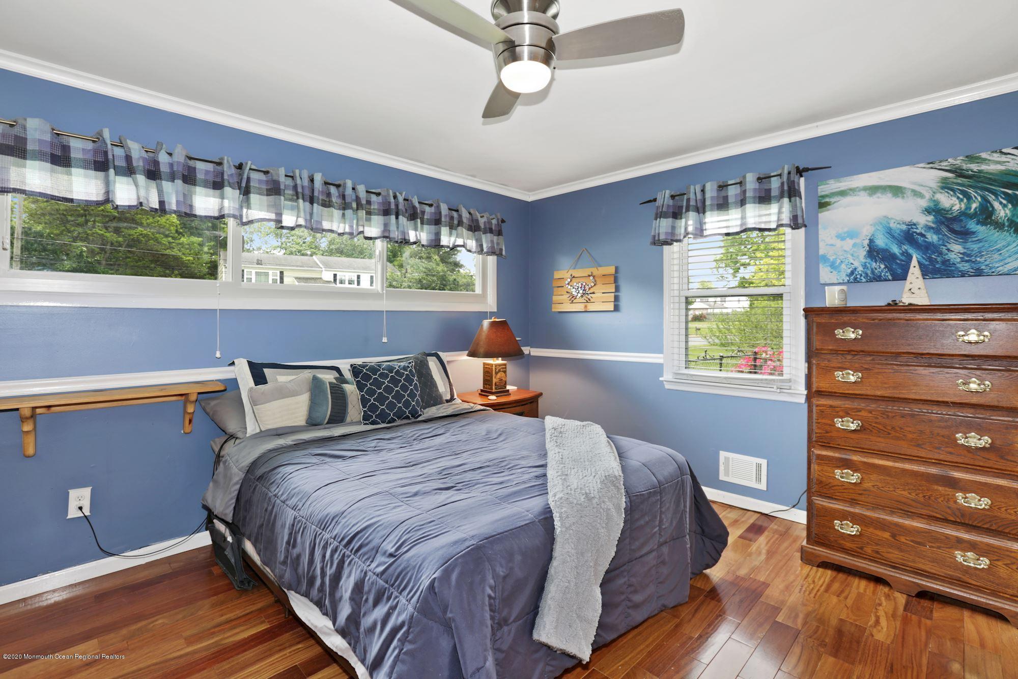429 Crestview Terrace Brick, NJ 08723 - Photo 23 of 29 a bed sitting in a bedroom next to a window
