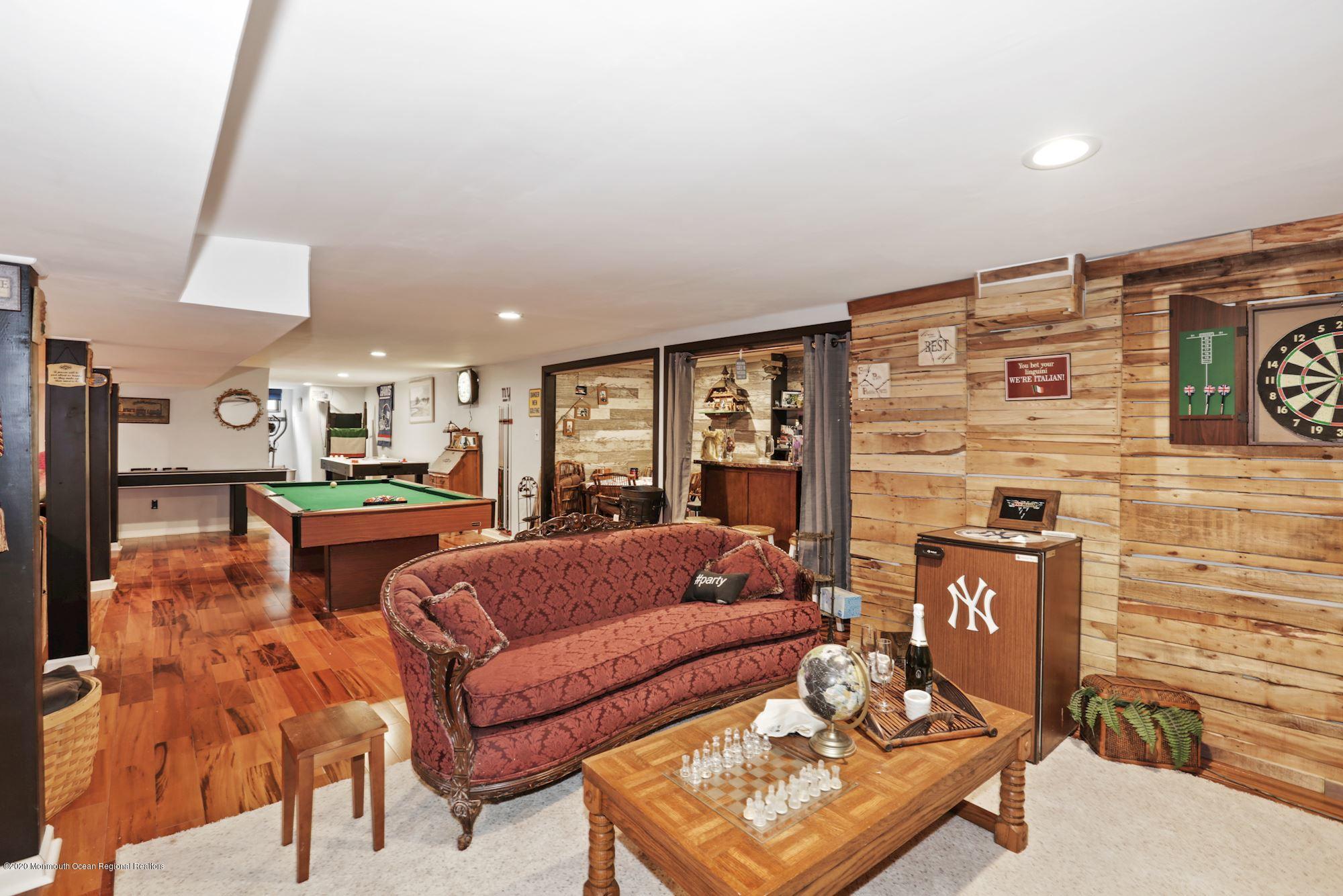 429 Crestview Terrace Brick, NJ 08723 - Photo 27 of 29 a living room with furniture and a fireplace