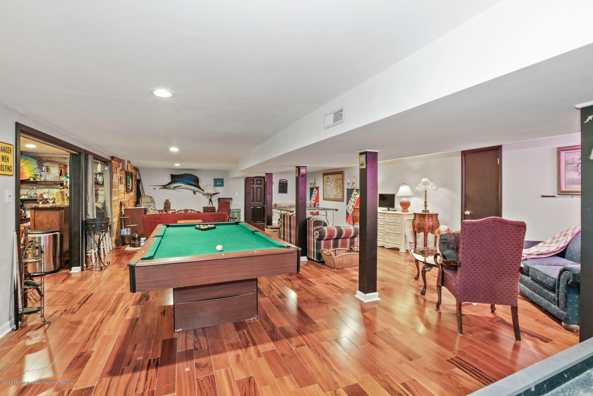 429 Crestview Terrace Brick, NJ 08723 - Photo 29 of 29 a living room with furniture and a wooden floor