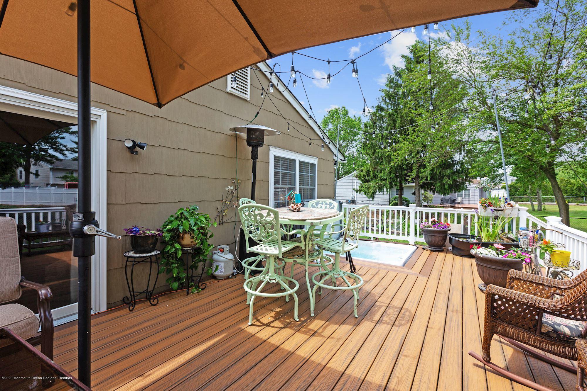 429 Crestview Terrace Brick, NJ 08723 - Photo 7 of 29 a view of a chairs and table on the balcony
