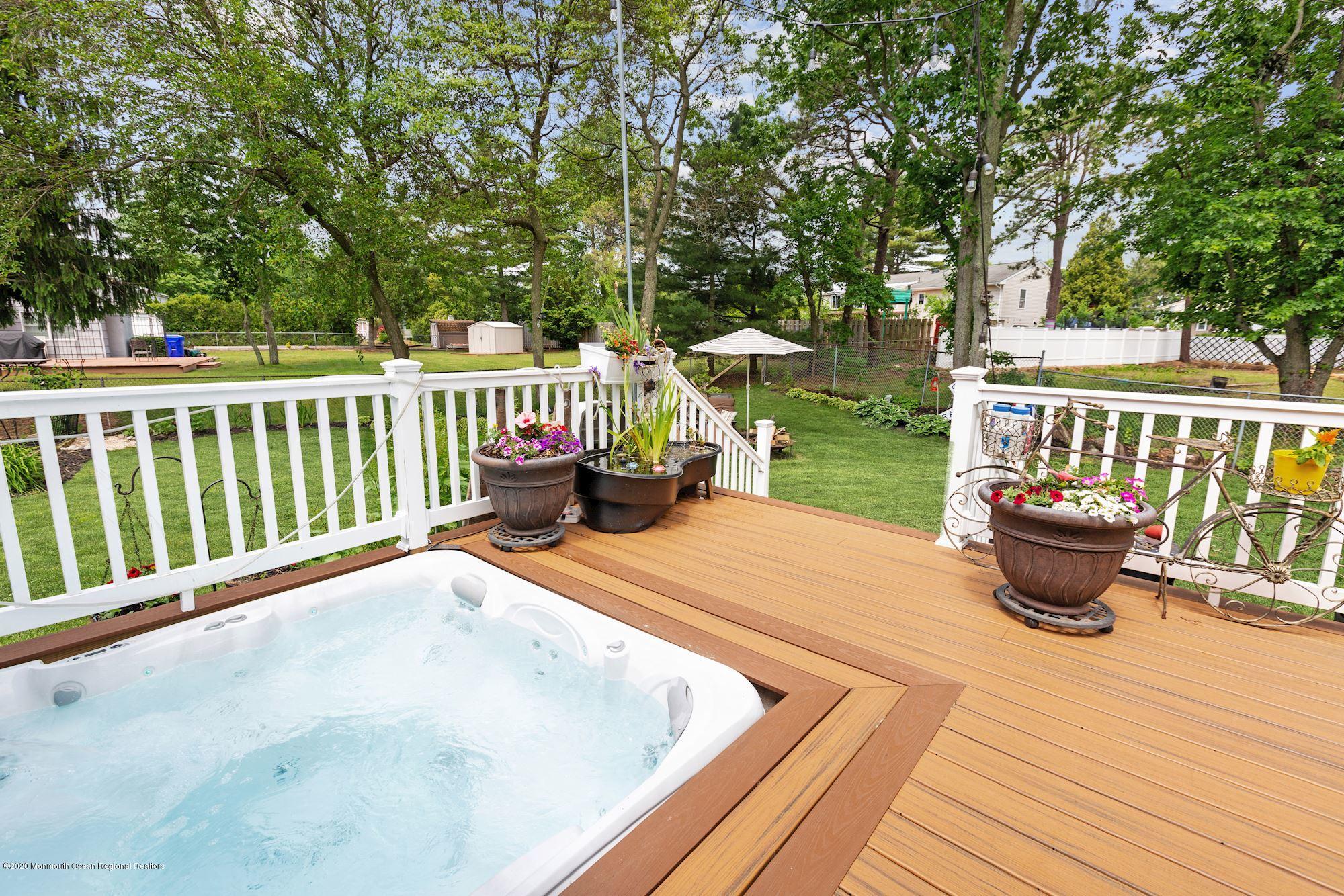 429 Crestview Terrace Brick, NJ 08723 - Photo 8 of 29 a balcony with wooden floor and fence