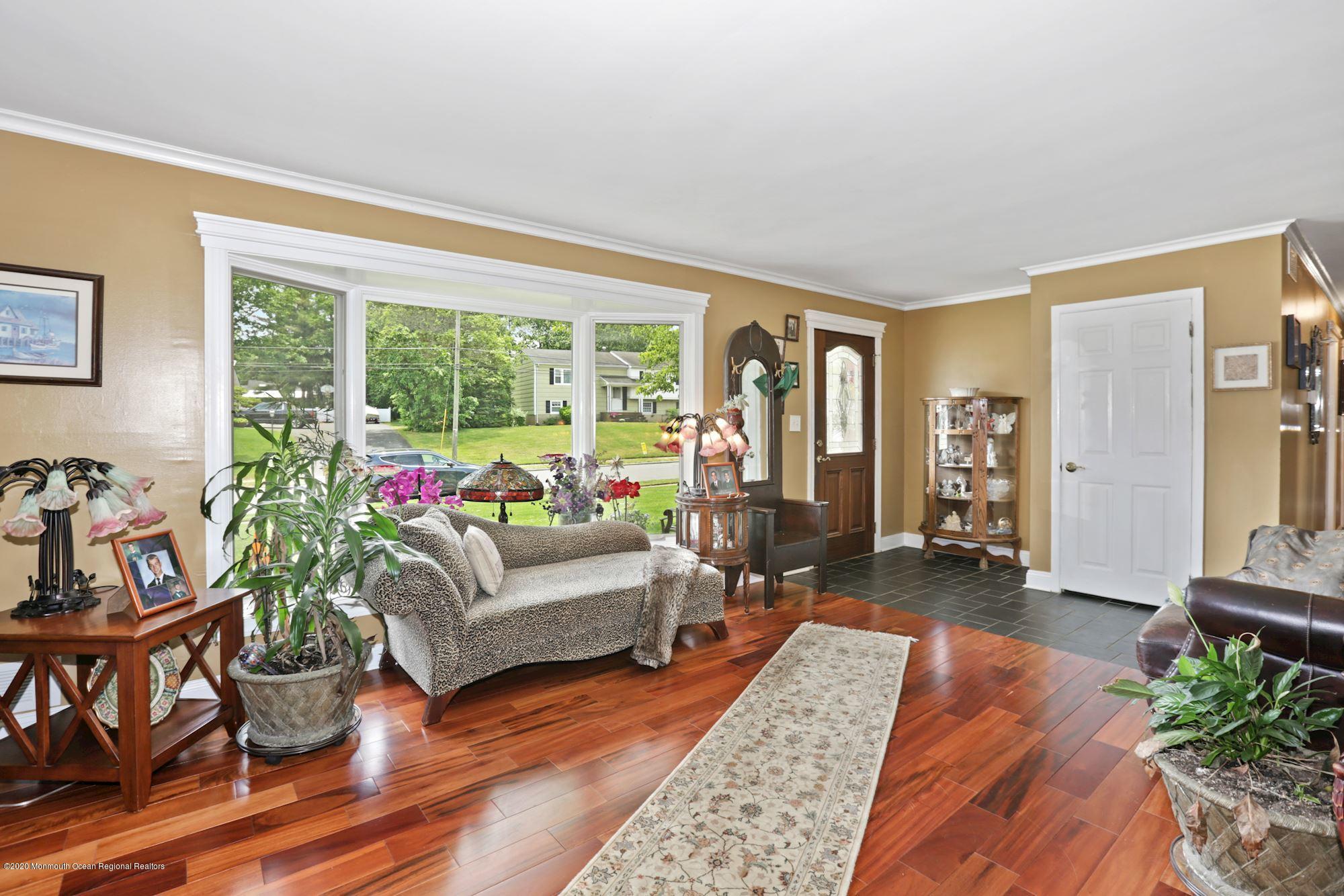 429 Crestview Terrace Brick, NJ 08723 - Photo 9 of 29 a living room with furniture and a potted plant