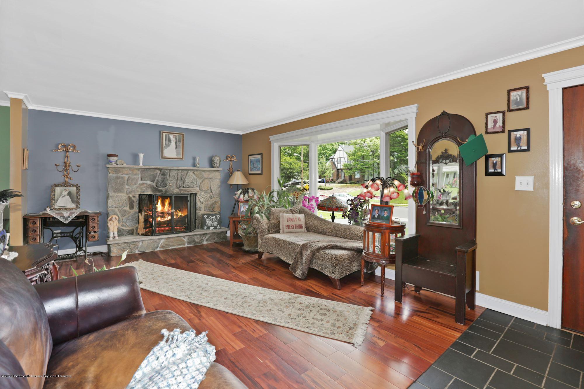 429 Crestview Terrace Brick, NJ 08723 - Photo 10 of 29 a living room with furniture and a fireplace
