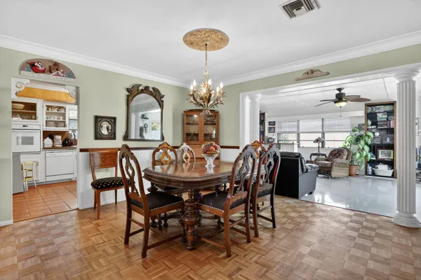 a dining room with furniture and window