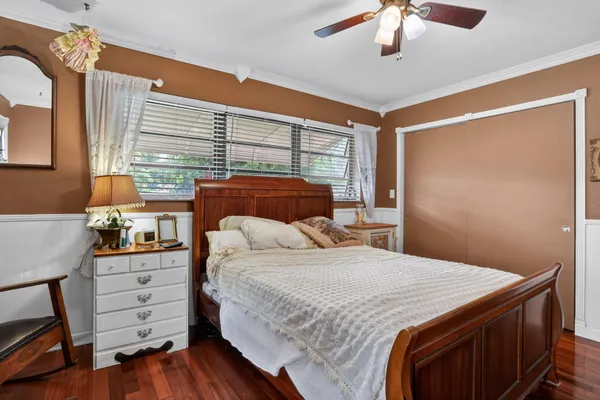 a bedroom with a bed and a dresser