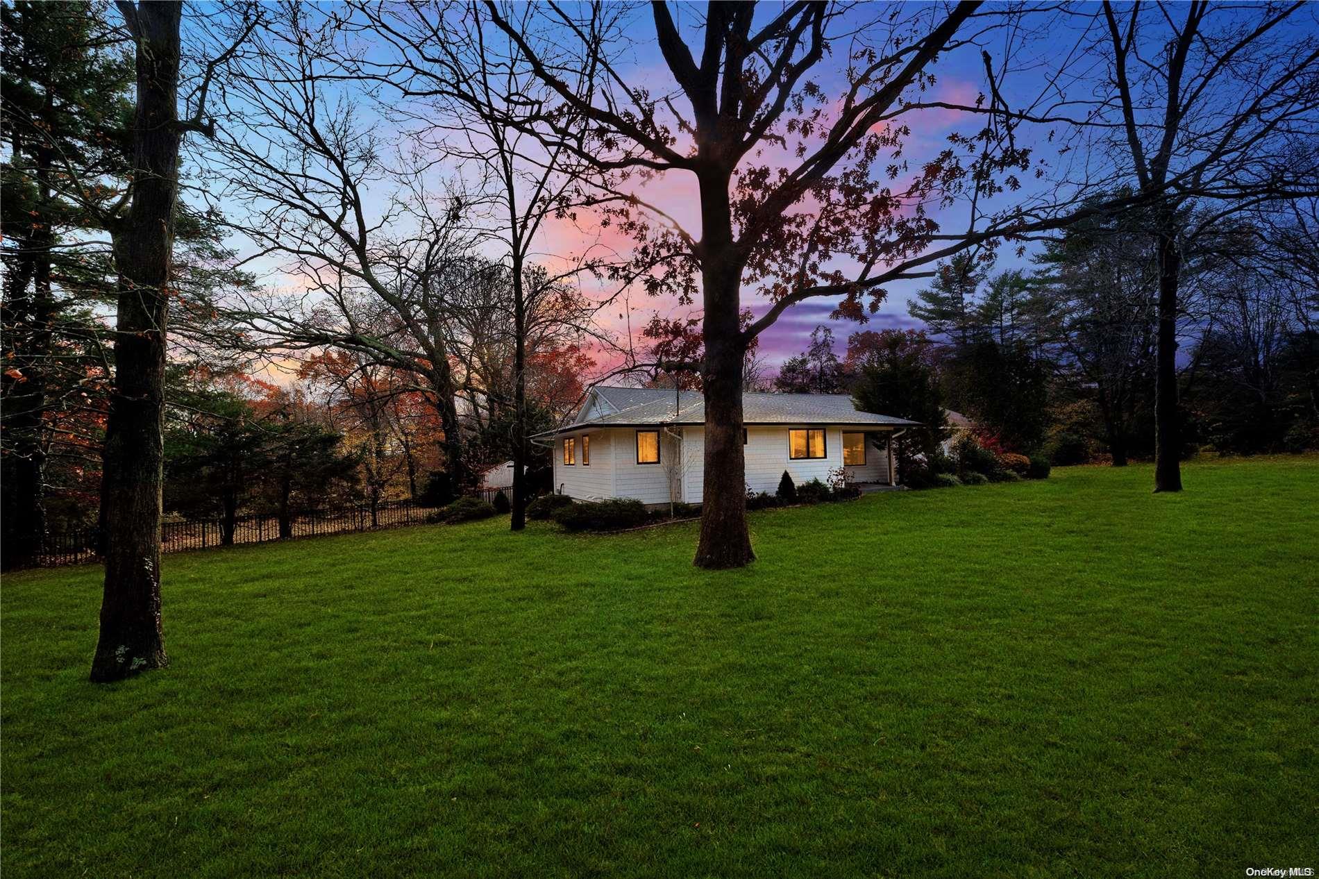a view of a yard with a house in the background