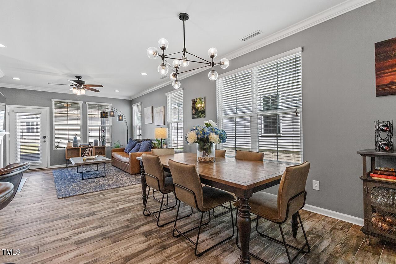 1420 Southpoint Trail Durham, NC 27713 - Photo 11 of 33 a view of a dining room with furniture window and wooden floor