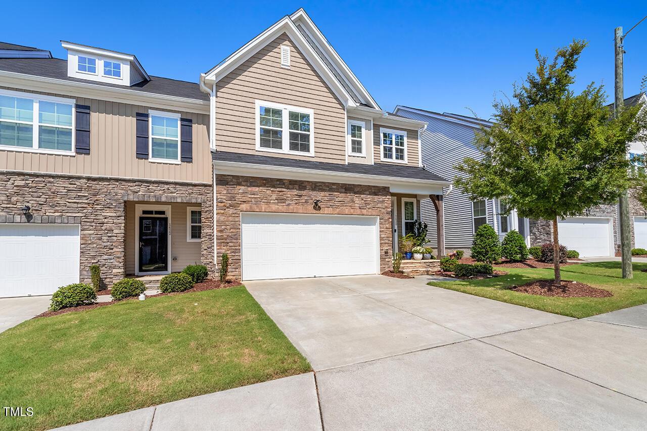 1420 Southpoint Trail Durham, NC 27713 - Photo 2 of 33 a front view of a house with a yard and garage