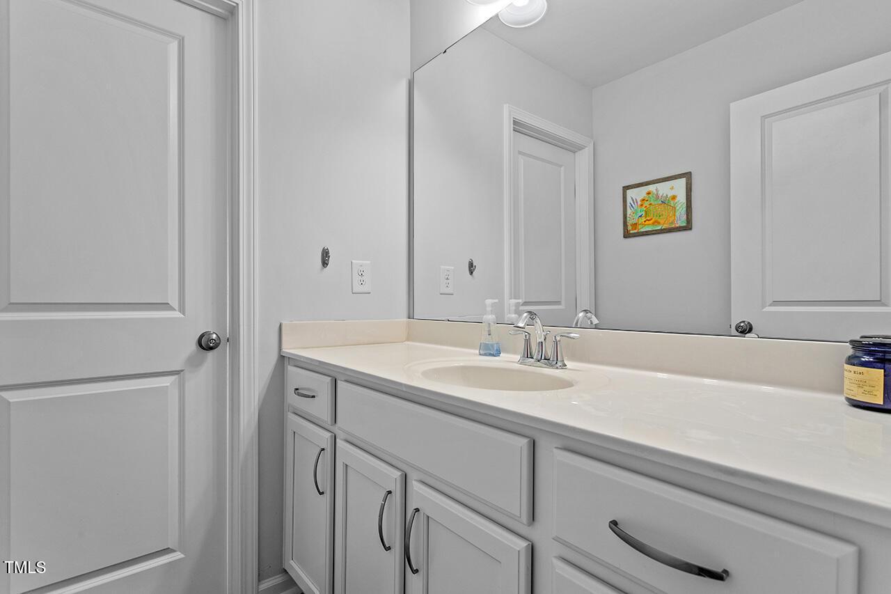 1420 Southpoint Trail Durham, NC 27713 - Photo 22 of 33 a bathroom with a sink and a mirror