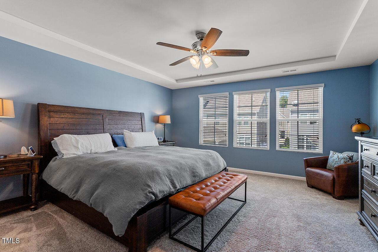 1420 Southpoint Trail Durham, NC 27713 - Photo 23 of 33 a bedroom with a bed a couch and a large window
