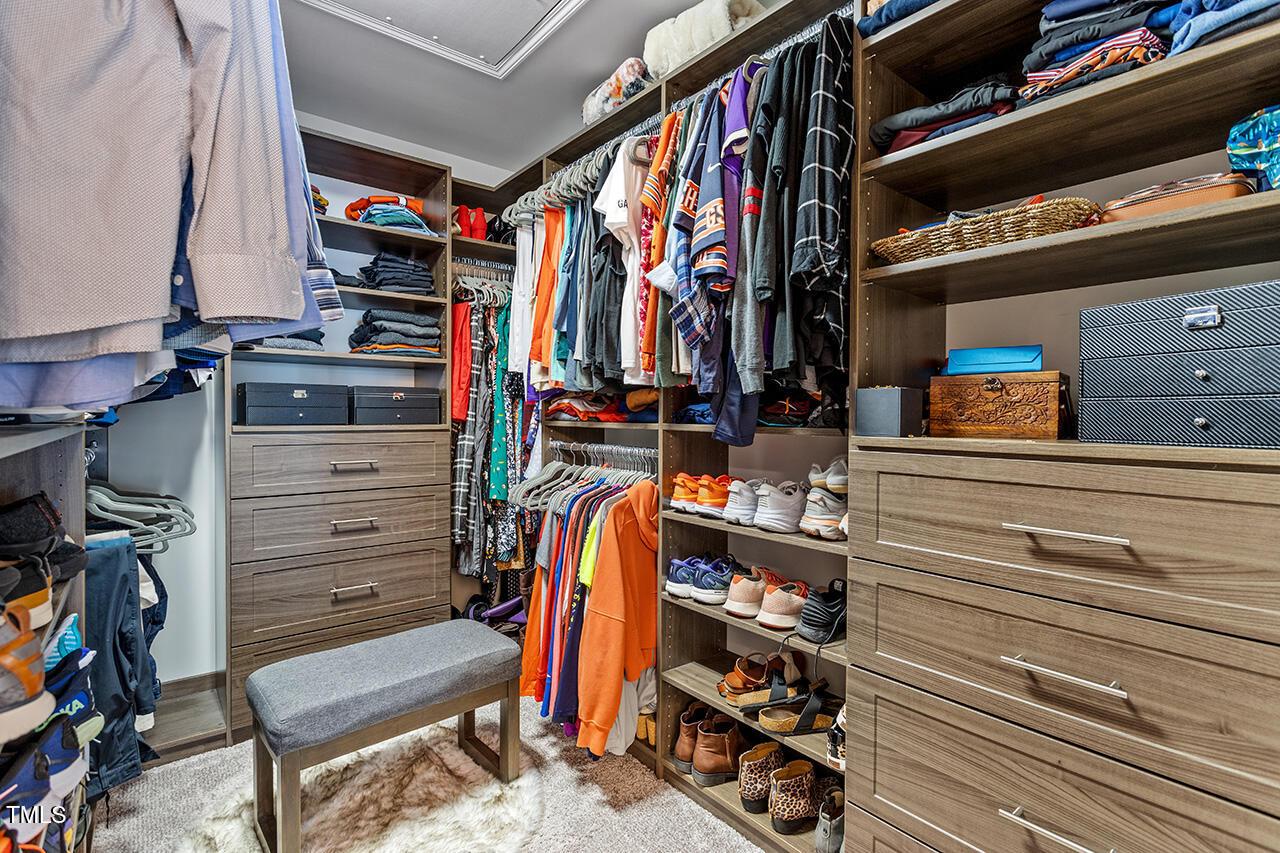 1420 Southpoint Trail Durham, NC 27713 - Photo 28 of 33 a view of walk in closet with clothes and shoes