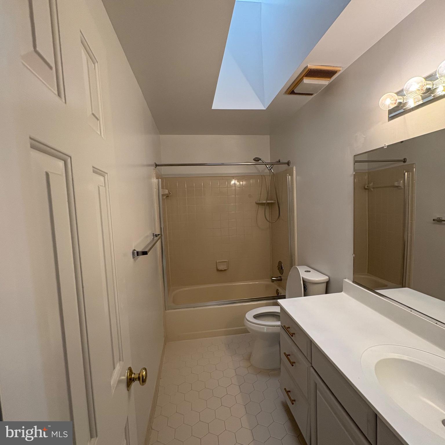 3502 Holly Road Annandale, VA 22003 - Photo 16 of 57 a bathroom with a granite countertop sink toilet and shower