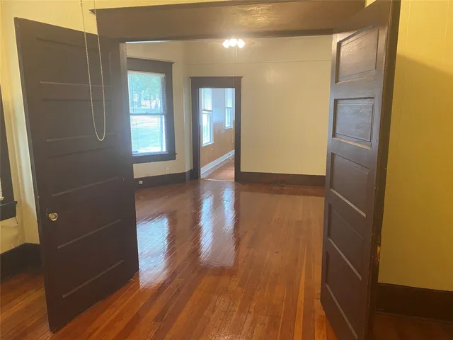 a view of livingroom with hardwood floor and hallway