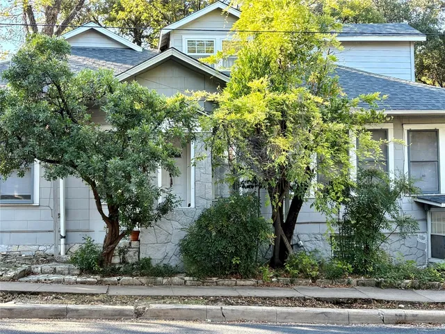 a view of a house with a street