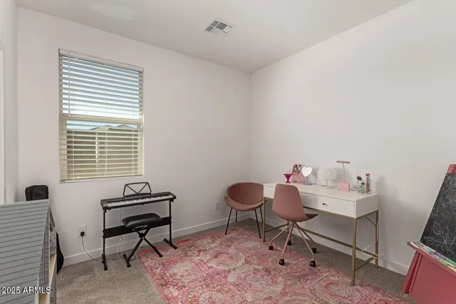 a workspace with furniture and a window