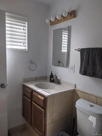 a room with toys and dresser with wooden floor