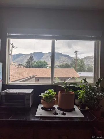 a bedroom with bed and a window