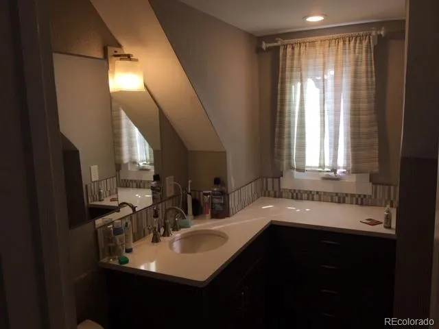 a kitchen with sink cabinets and window