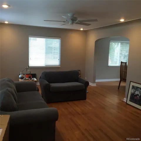 a view of a livingroom with furniture and wooden floor