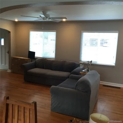 a bedroom with furniture and a window