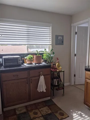 a bedroom with furniture and a lamp