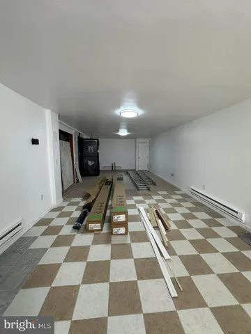 a backyard with a black white checkered floor with a black white checkered floor