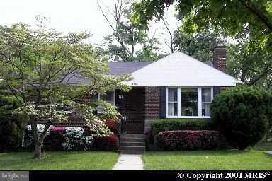 3702 Greenly Street Silver Spring, MD 20906 - Photo 1 of 1 a front view of a house with a garden