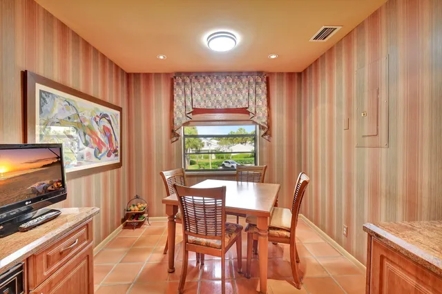 a bedroom with double bed and a large window