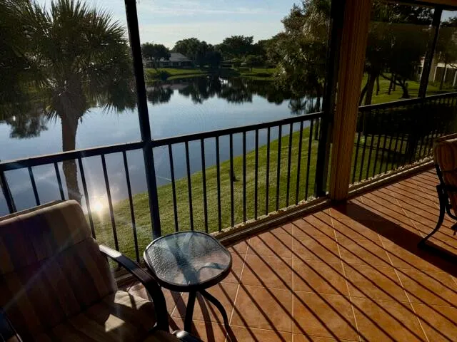 a view of balcony with wooden floor and outdoor seating