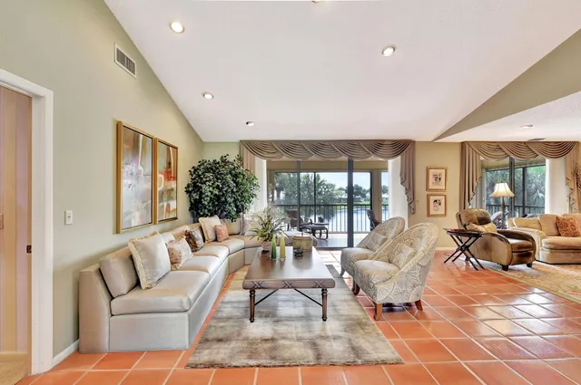 a view of a swimming pool with a yard