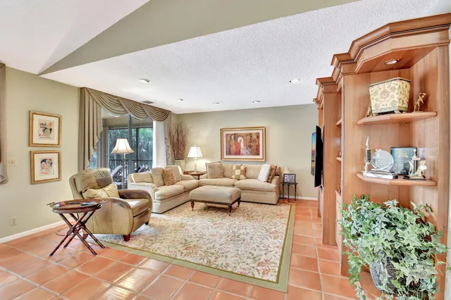 a view of a chairs and table in the balcony